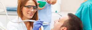 female-dentist-examining-patient